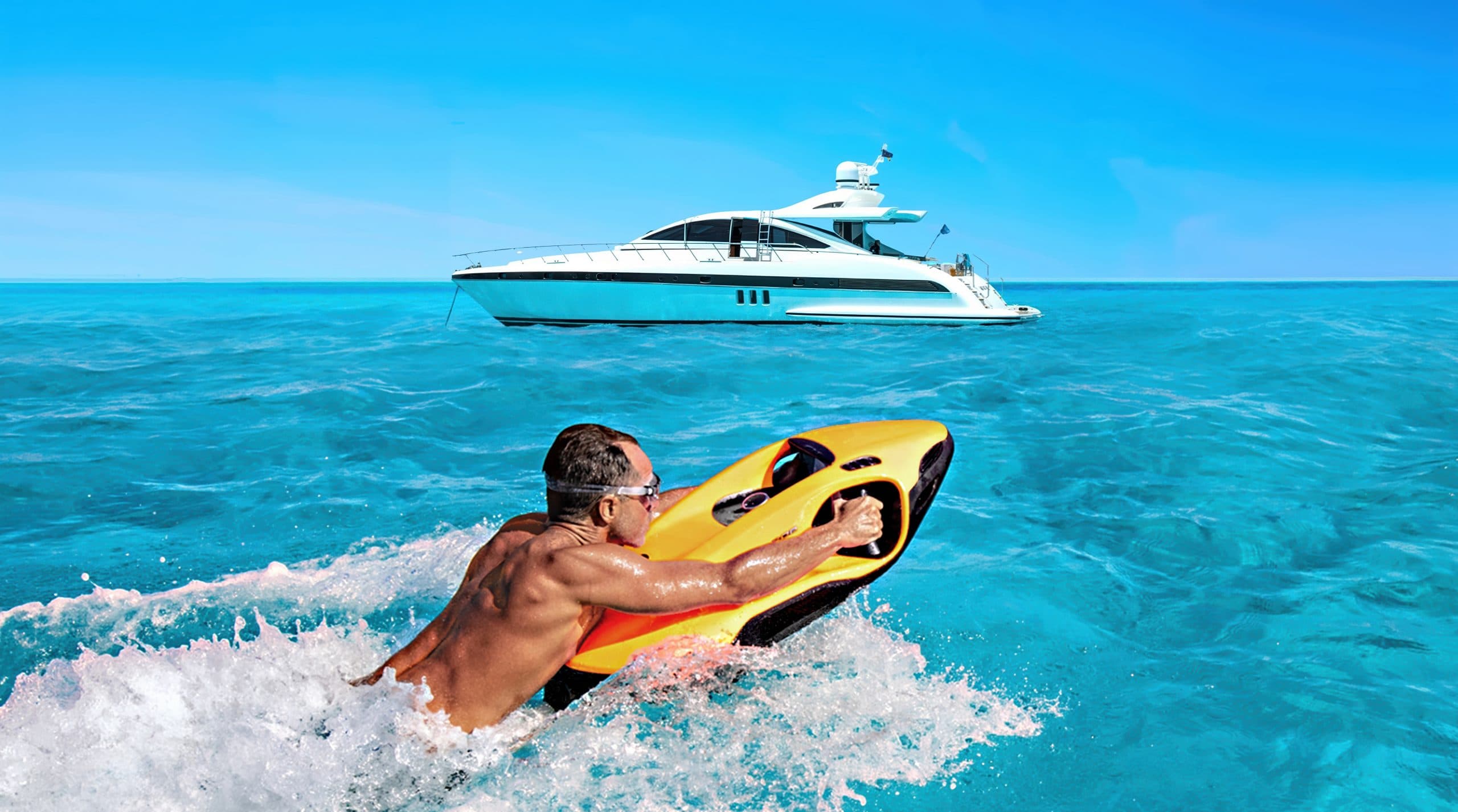 Seabob F9 rider gliding past a yacht in turquoise water